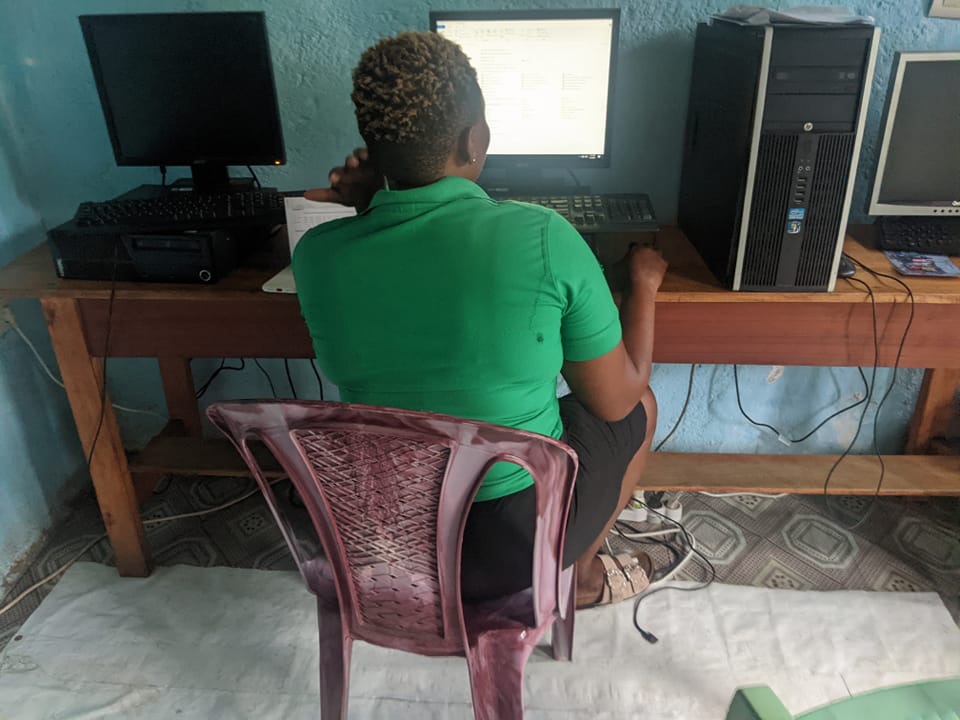 Adults learning tech skills at Smiles Media Training Center